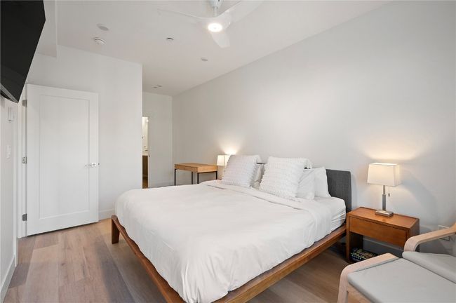 Bedroom with ceiling fan and hardwood / wood-style flooring | Image 19