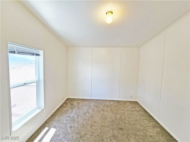 Unfurnished room featuring carpet floors | Image 17