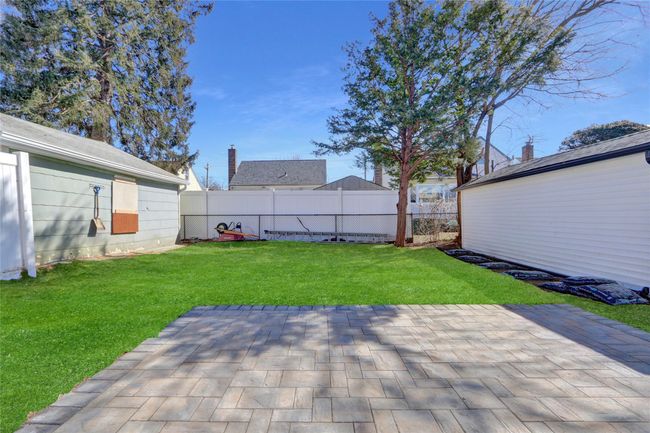View of yard featuring a patio, an outdoor structure, and fence | Image 26