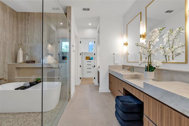 Full bathroom featuring vanity, a freestanding bath, a shower stall, tile patterned floors, and recessed lighting | Image 23