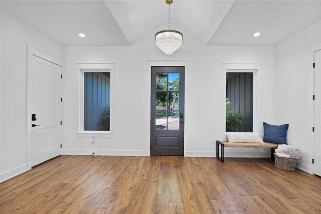 Foyer entrance featuring hardwood / wood-style flooring, an inviting chandelier, recessed lighting, and baseboards | Image 8
