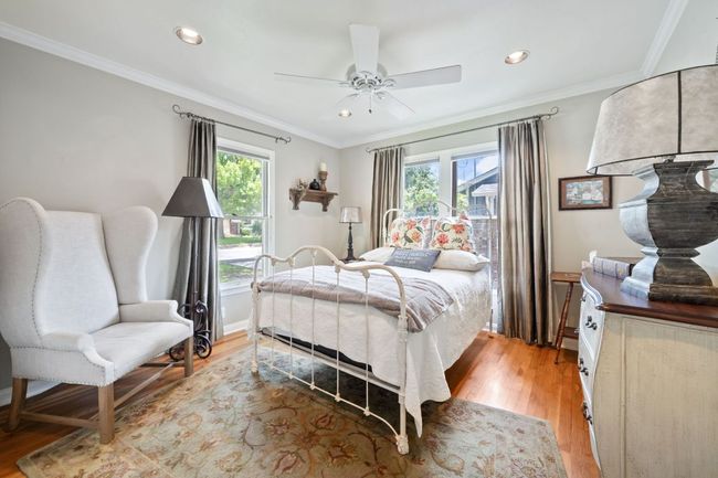 Bedroom featuring light wood-type flooring, crown molding, recessed lighting, and ceiling fan | Image 9