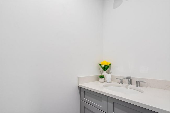 Unit #1: Left side, half bathroom on the main level. | Image 7