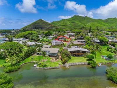 This gorgeous custom home in the Ko'olau Vista subdivision sits on a private lane with just 7 other custom homes. Directly on the border of Kailua and in the Kailua school district, this property is just 2 homes from the ocean and has deeded ocean access. The underground electricity and deeded view corridors ensure that this home maintains an unobstructed panoramic view of Kaneohe Bay and the Ko'olau Mountains. This home is situated to have one of the best views on the lane. | Image 1