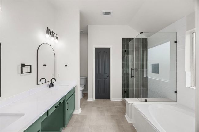 Elegant Primary Bath with Vanity & Tall Ceilings | Image 24