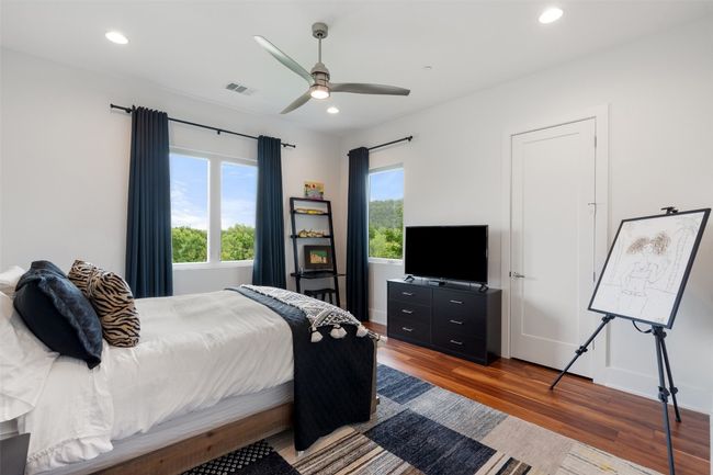 A thoughtfully designed bedroom offering style and serenity. | Image 32