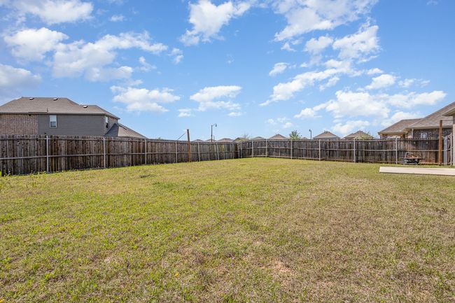 View of yard with a fenced backyard | Image 29