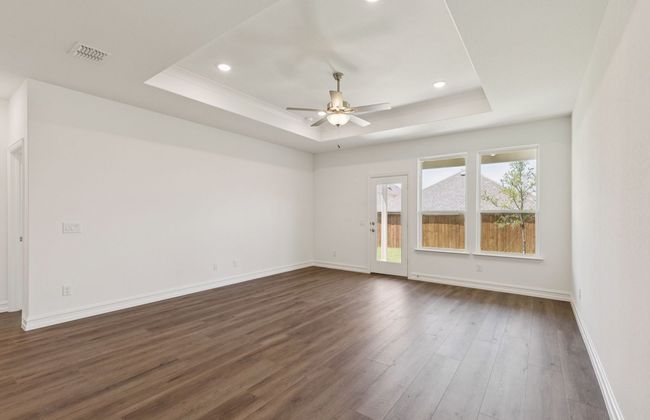 Gathering room drenched in natural light, creating a warm atmosphere *Real home pictured | Image 7