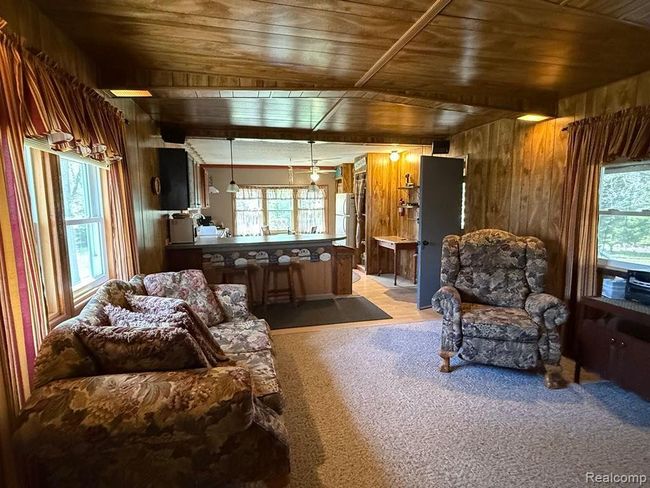 Living room that is open to the kitchen | Image 14