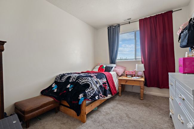 Bedroom with carpet flooring | Image 16