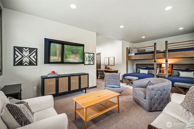 What kid wouldn't love this room? Bunk beds, TV or Video Game Playing area, sofa, chairs, and their own bathroom. It's a kids paradise. | Image 19