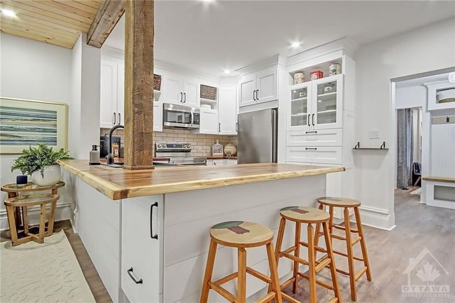 Live Edge Countertop on 2 sides allowing for stools. 3 are shown here but can accommodate more | Image 12