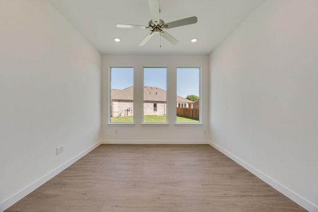 Spare room featuring recessed lighting, light wood-type flooring, and a ceiling fan | Image 6