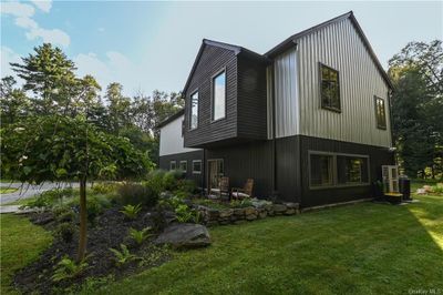 View of side of property featuring a lawn | Image 1