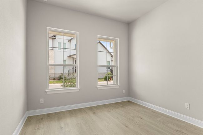 Unfurnished room with light wood-style flooring, healthy amount of natural light, and baseboards | Image 29