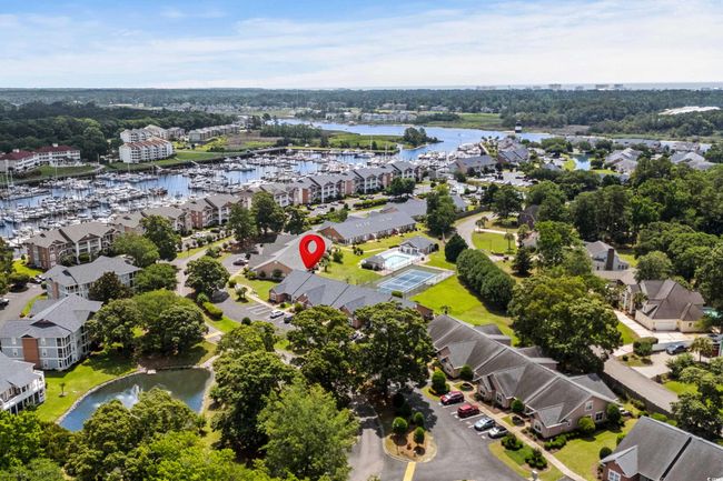 Aerial view of residential area featuring a large body of water | Image 39