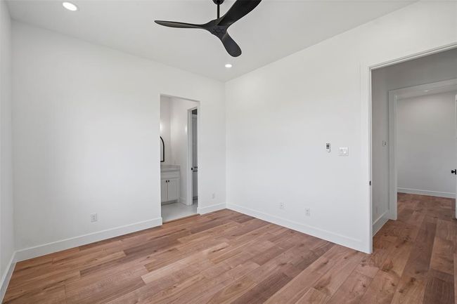 Cozy third bedroom with ample closet space and natural light. | Image 44