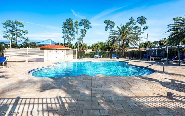 Community pool at main clubhouse featuring fence and a patio | Image 37