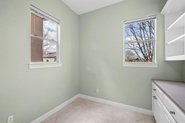 Downstairs room next to the laundry room makes for a great second study loaded with light, and more tranquil views of the estate. | Image 39