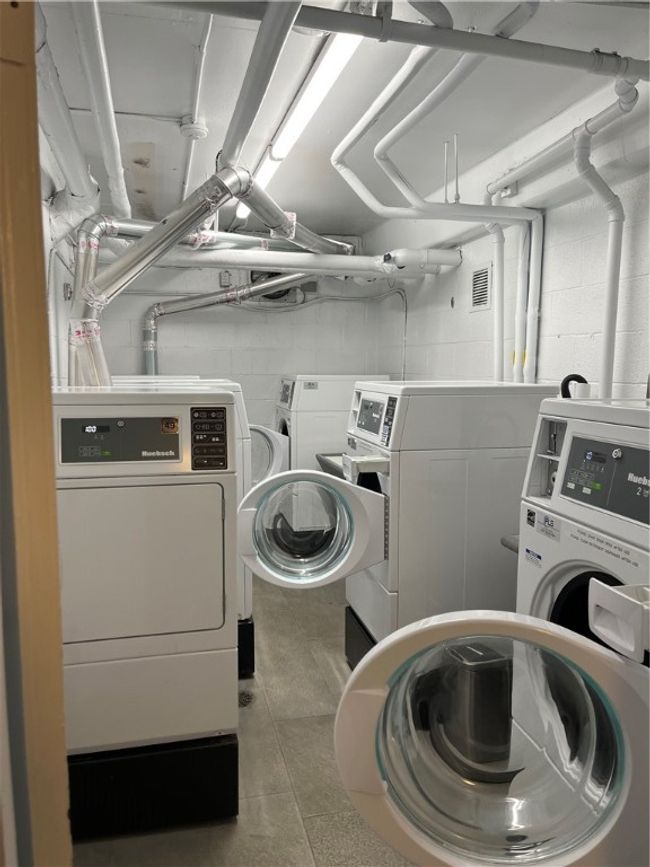 in house laundry on lower level All machines are efficient and new | Image 30