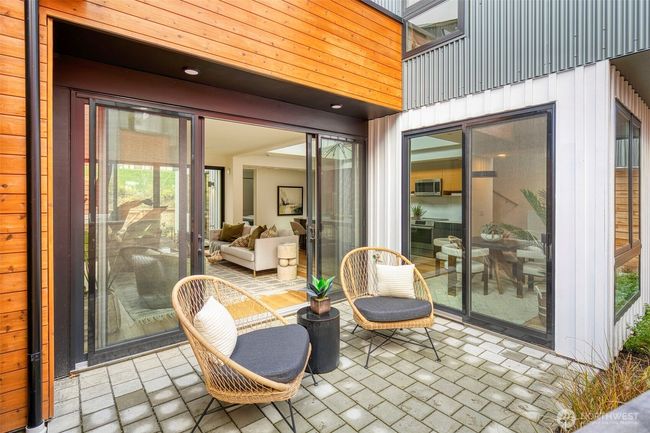 This front patio is one of three inviting outdoor living spaces for your enjoyment. | Image 12