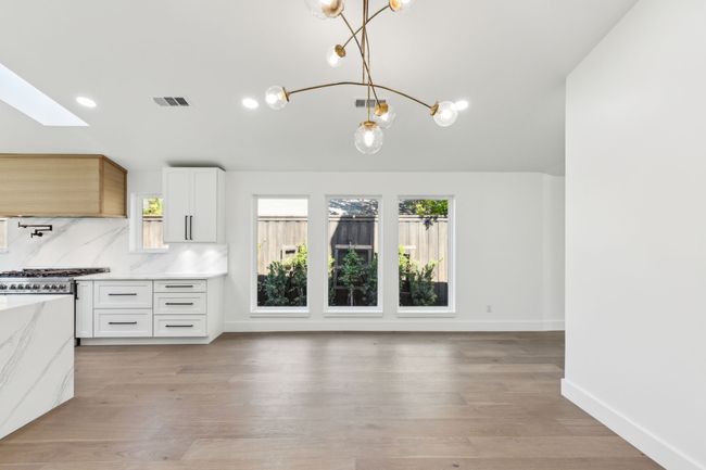 Large dining area open to kitchen. | Image 14
