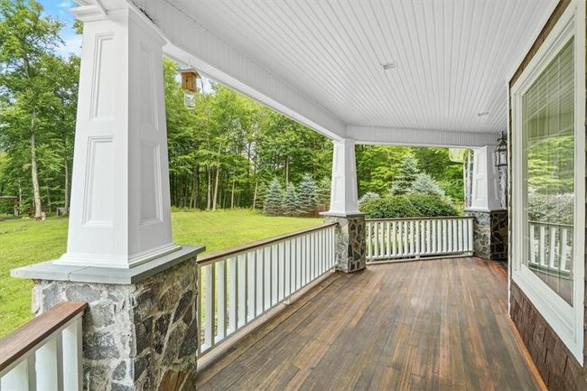 Brazilian Sapele Flooring & Craftsman Square Tapered Columns leading to your front entry. | Image 6