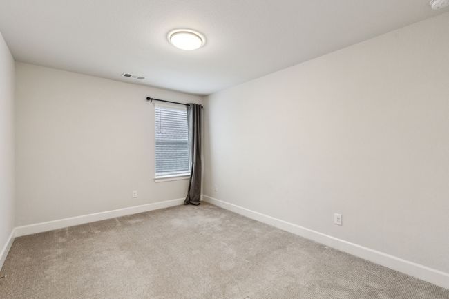 Unfurnished room with baseboards and light colored carpet | Image 26