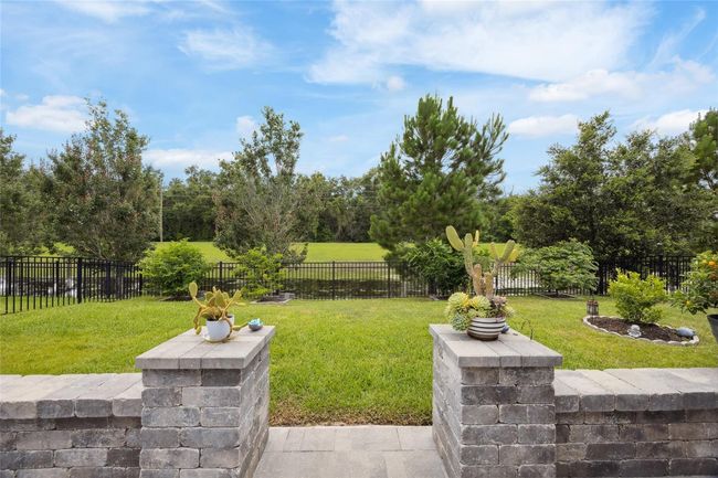 extended large custom patio with beautiful views of backyard | Image 28