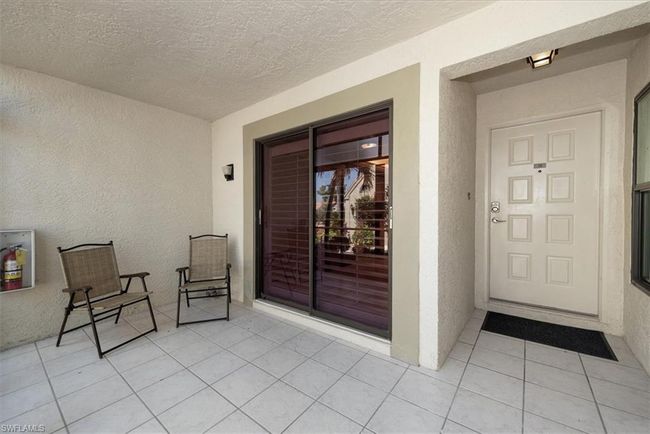 Doorway to property with stucco siding | Image 6