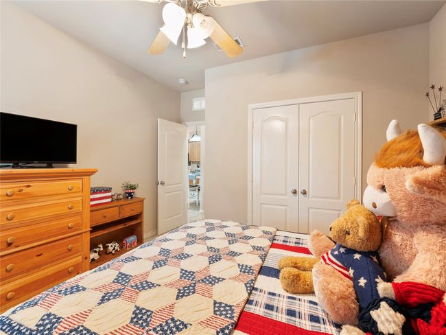 Bedroom featuring a closet and a ceiling fan | Image 14