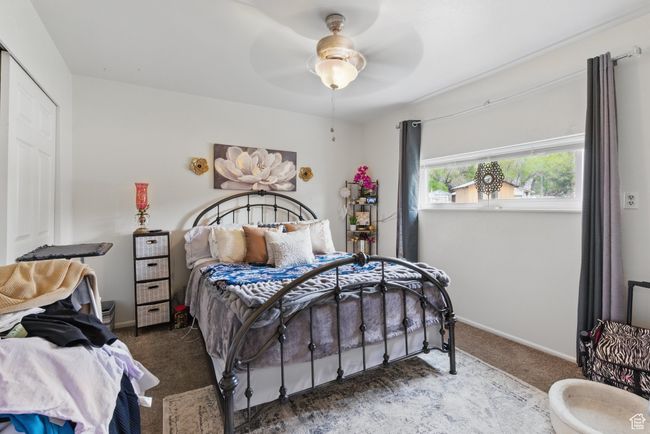 Carpeted bedroom with baseboards and ceiling fan | Image 42