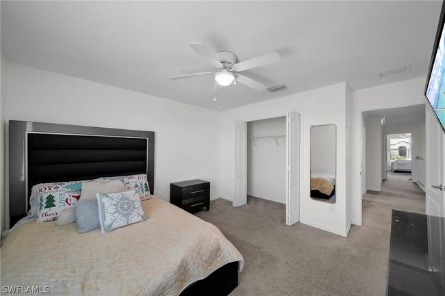 Bedroom featuring a closet, carpet floors, and ceiling fan | Image 38