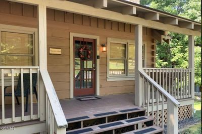 Karens cabin front porch door | Image 2