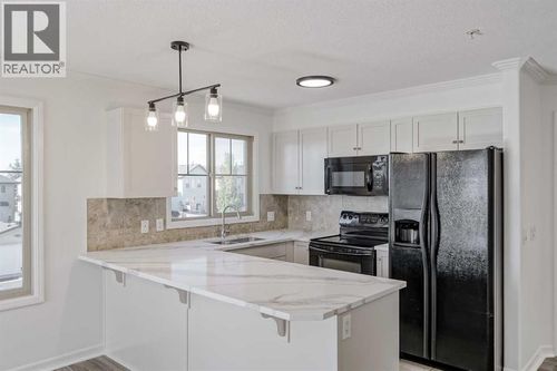 1206-92 Crystal Shores Rd, Okotoks, AB, T1S2M8 | Card Image