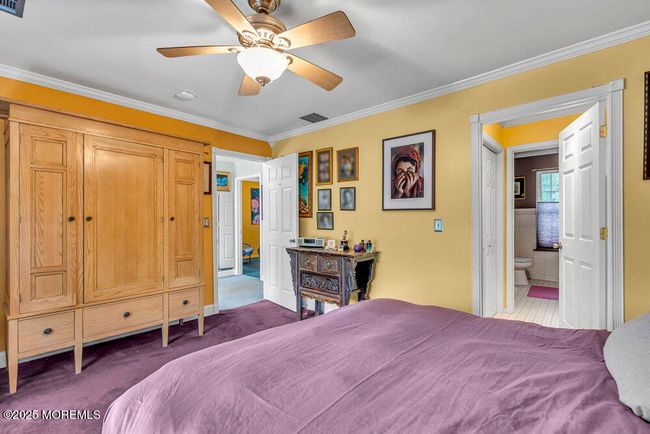 Ample storage and private bath. Combination tub and shower. | Image 25