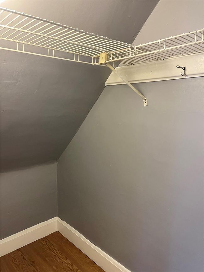 Walk in closet featuring wood finished floors | Image 13