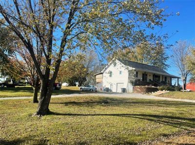 View of side of property featuring a yard | Image 1