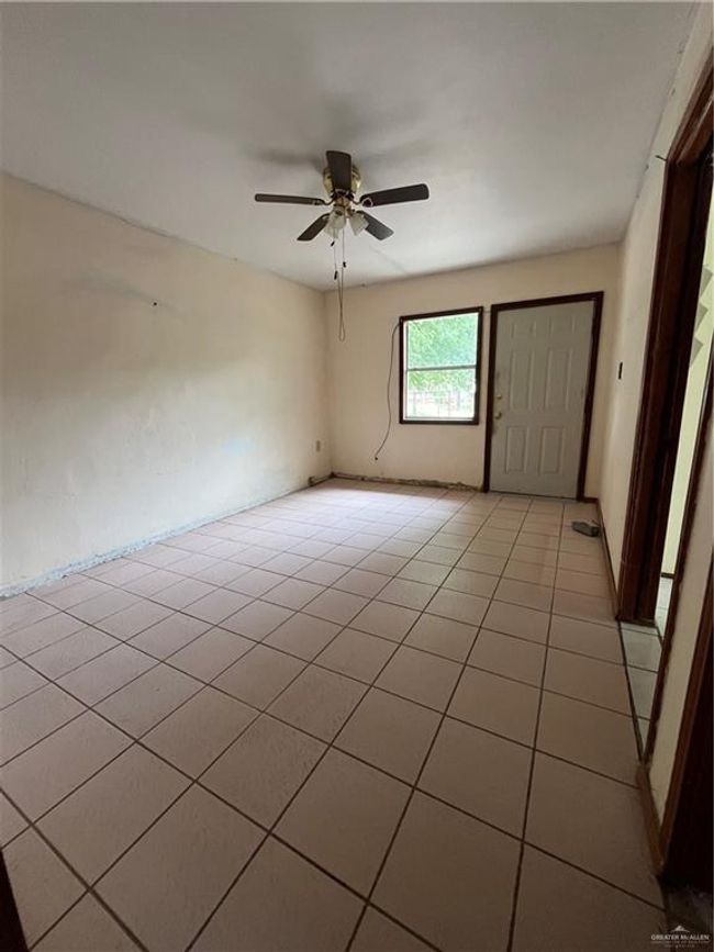 Spare room with light tile patterned floors and a ceiling fan | Image 5