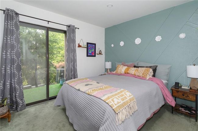 Bedroom 2 with sliding doors to patio area | Image 11