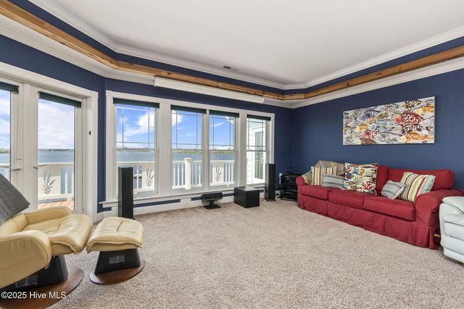 with uncovered deck access and water views | Image 25