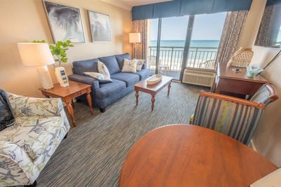 Living room featuring a water view | Image 2