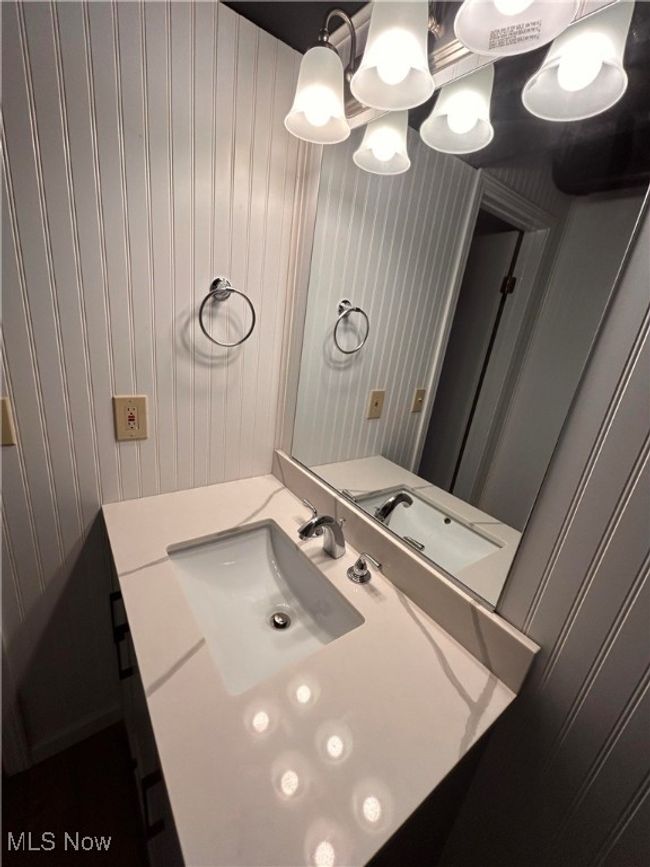 Bathroom with vanity and wallpapered walls | Image 12