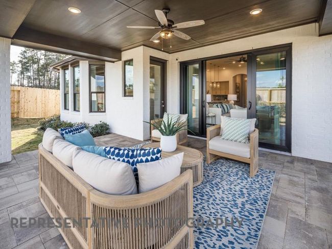 View of patio with ceiling fan and an outdoor living space | Image 33