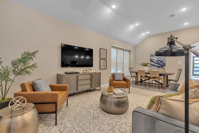 Living room with light wood-style floors, vaulted ceiling, and recessed lighting | Image 16