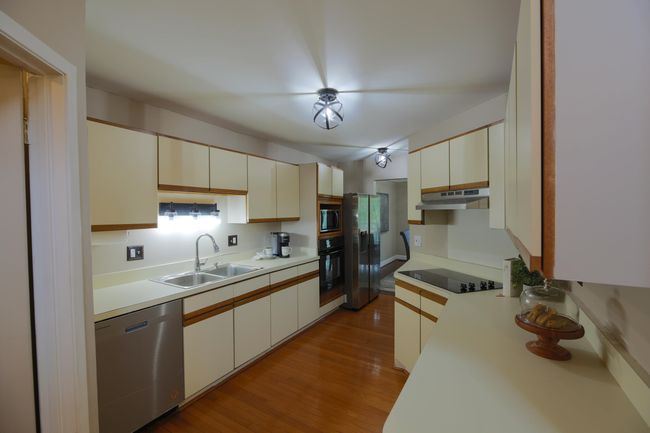 Tons of cabinets and countertop space in this kitchen with all appliances included. | Image 8