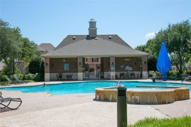 Community pool featuring a patio and a jacuzzi | Image 22
