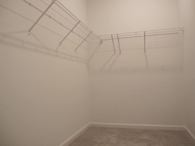 Primary bedroom inside walk-in closet | Image 26