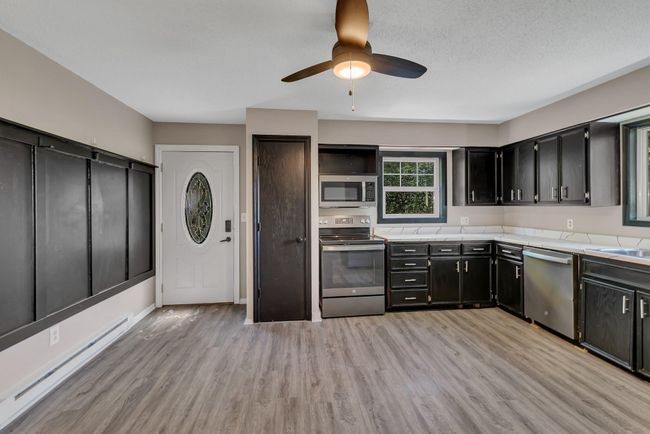 Main level entry right off kitchen, perfect for grocery drops | Image 8