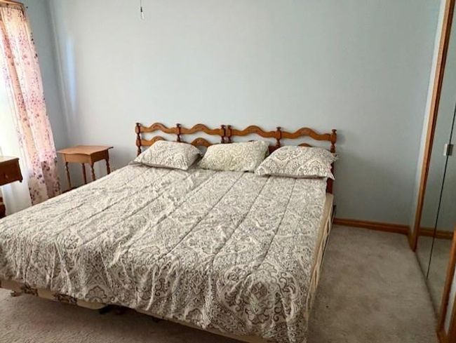 Carpeted bedroom featuring baseboards | Image 22